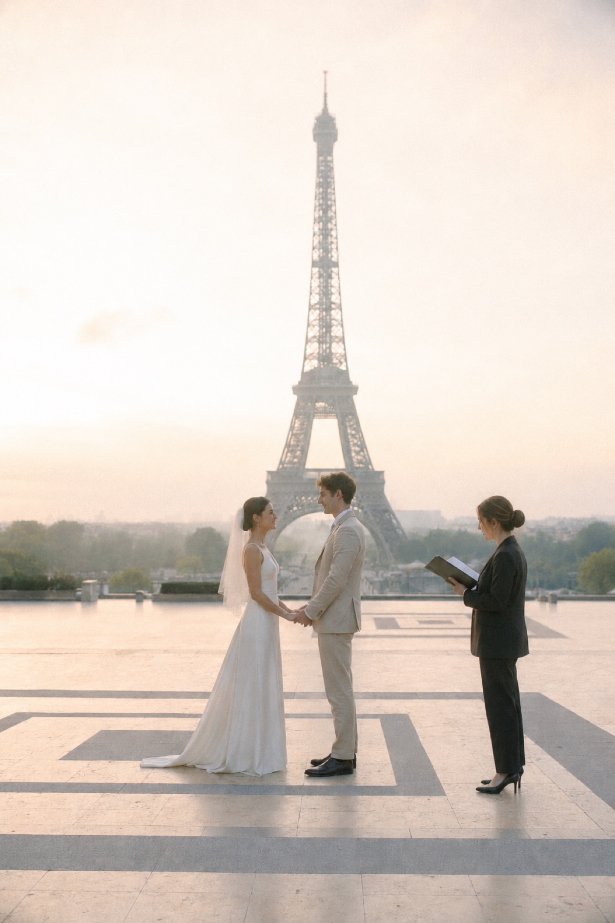 Elopement ceremony in Paris at the Trocadéro, the Eiffel Tower behind the couple at golden hour.